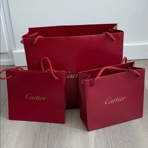 Three Authentic Cartier shopping bags